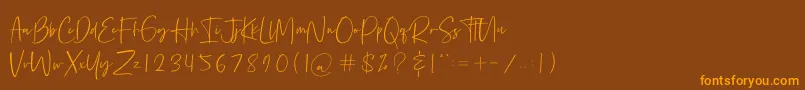 フォントBethoven – オレンジ色の文字が茶色の背景にあります。