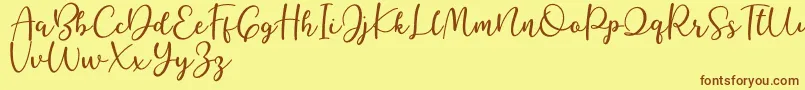 Better Caramel-Schriftart – Braune Schriften auf gelbem Hintergrund