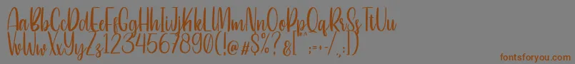 フォントBetterlove – 茶色の文字が灰色の背景にあります。