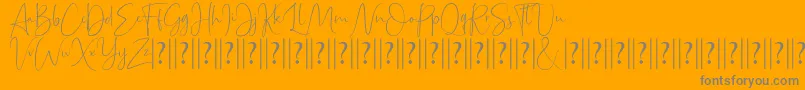 Bettrish Dafont-Schriftart – Graue Schriften auf orangefarbenem Hintergrund