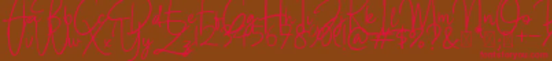 BettyLavea Font – Red Fonts on Brown Background