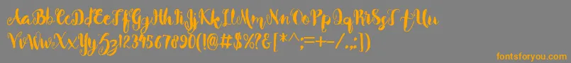フォントBeverly – オレンジの文字は灰色の背景にあります。