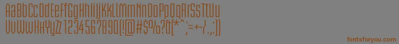 フォントBriemakademistdCond – 茶色の文字が灰色の背景にあります。