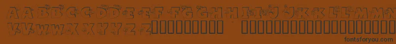 Шрифт GrazingOnGrass – чёрные шрифты на коричневом фоне