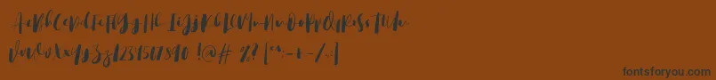 Bigstrom DEMO Font – Black Fonts on Brown Background