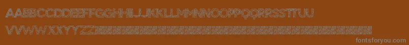 BigTangle-Schriftart – Graue Schriften auf braunem Hintergrund