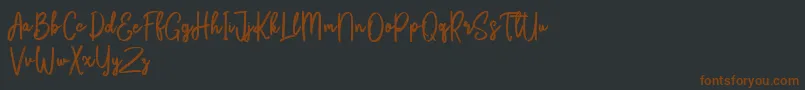 Bikarosta Script-fontti – ruskeat fontit mustalla taustalla