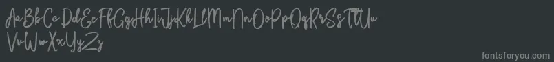 Fonte Bikarosta Script – fontes cinzas em um fundo preto
