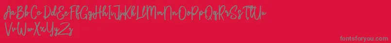 Fonte Bikarosta Script – fontes cinzas em um fundo vermelho