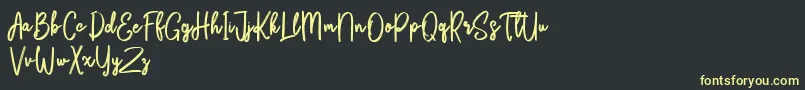 fuente Bikarosta Script – Fuentes Amarillas Sobre Fondo Negro