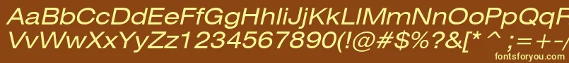 HeliosextItalic-fontti – keltaiset fontit ruskealla taustalla