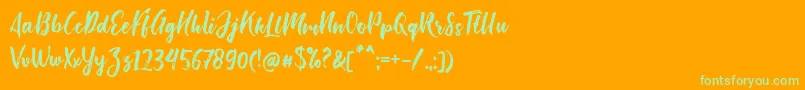 Fonte Bishella Script – fontes verdes em um fundo laranja