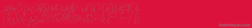 Bitlamero Script-Schriftart – Graue Schriften auf rotem Hintergrund