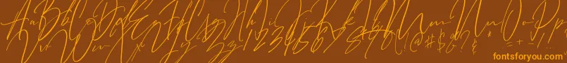 フォントBitter Mind – オレンジ色の文字が茶色の背景にあります。