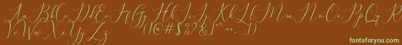 フォントBitthai Script – 緑色の文字が茶色の背景にあります。