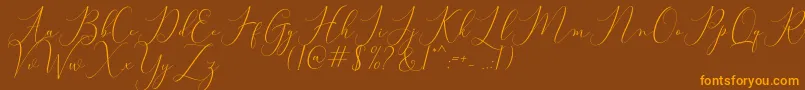 Bitthai Script-fontti – oranssit fontit ruskealla taustalla