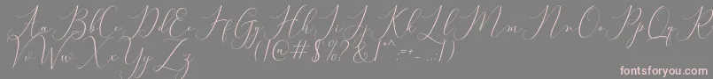 Bitthai Script-Schriftart – Rosa Schriften auf grauem Hintergrund