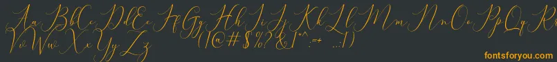 Bitthai Script-fontti – oranssit fontit mustalla taustalla