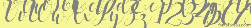 black stud-Schriftart – Graue Schriften auf gelbem Hintergrund