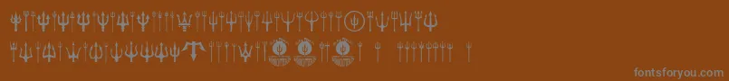 Black Trident-Schriftart – Graue Schriften auf braunem Hintergrund