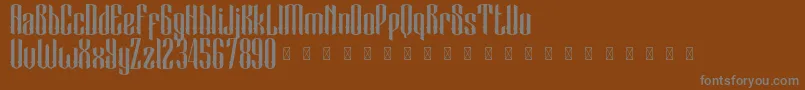BlackCameo Demo-fontti – harmaat kirjasimet ruskealla taustalla