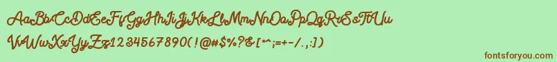 Шрифт Blackcode Script Stamp Free Personal Use – коричневые шрифты на зелёном фоне