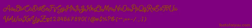 Шрифт Blackcode Script Stamp Free Personal Use – коричневые шрифты на фиолетовом фоне