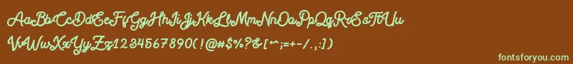 フォントBlackcode Script Stamp Free Personal Use – 緑色の文字が茶色の背景にあります。