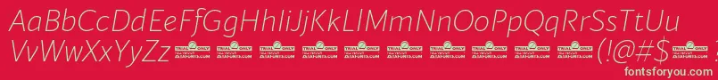 Blacker Sans Extralight Italic trial-Schriftart – Grüne Schriften auf rotem Hintergrund