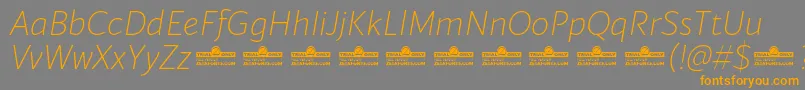 Blacker Sans Extralight Italic trial Font – Orange Fonts on Gray Background