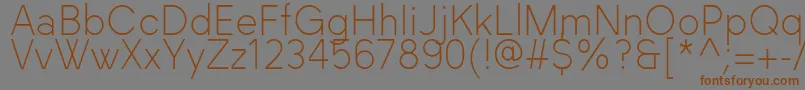 フォントBlackLabel Light – 茶色の文字が灰色の背景にあります。