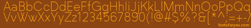 フォントBlackLabel Light – オレンジ色の文字が茶色の背景にあります。