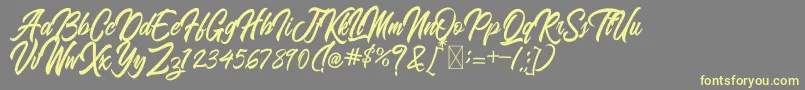 BlangkonScript-Schriftart – Gelbe Schriften auf grauem Hintergrund
