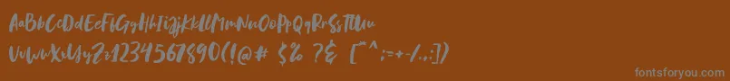Blastpink Script Font – Gray Fonts on Brown Background