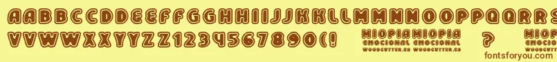 フォントMiopiaEmocional – 茶色の文字が黄色の背景にあります。