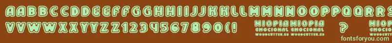 フォントMiopiaEmocional – 緑色の文字が茶色の背景にあります。