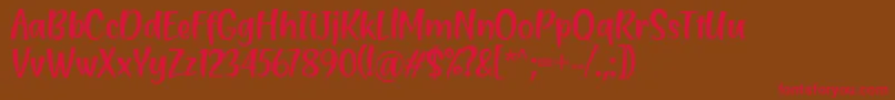 フォントBlending Attraction Regular Font by Situjuh 7NTypes – 赤い文字が茶色の背景にあります。
