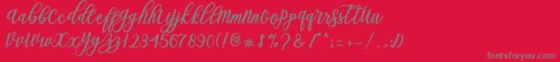 Blessed Script Font – Gray Fonts on Red Background
