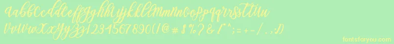 Blessed Script Font – Yellow Fonts on Green Background
