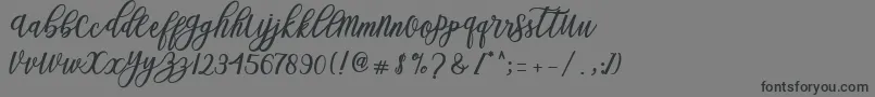 Blessed Script Font – Black Fonts on Gray Background