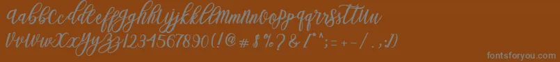 Weitere Informationen zur Blessed Script-Schriftart Blessed Script-Schriftart – Graue Schriften auf braunem Hintergrund