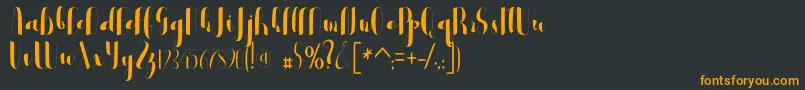 フォントblester – 黒い背景にオレンジの文字