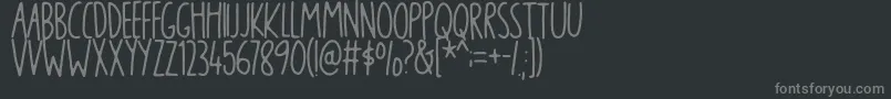 blikfangDEMO-fontti – harmaat kirjasimet mustalla taustalla