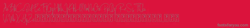 フォントBlista Rade – 赤い背景に灰色の文字