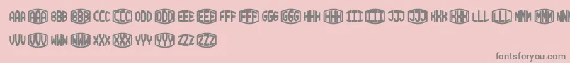 フォントBlockyMonogram – ピンクの背景に灰色の文字