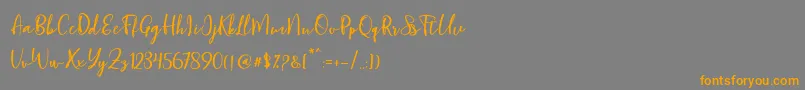 Blondy Script-Schriftart – Orangefarbene Schriften auf grauem Hintergrund