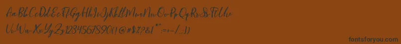 Blondy Slant Font – Black Fonts on Brown Background