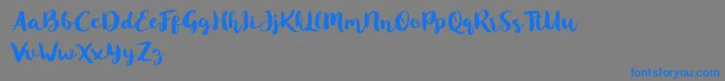 Blusty Script Free-Schriftart – Blaue Schriften auf grauem Hintergrund