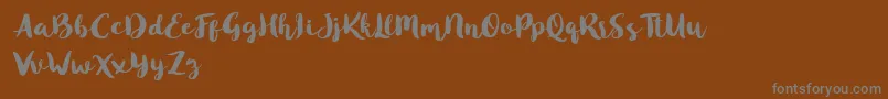 Saiba mais sobre a fonte Blusty Script Free Fonte Blusty Script Free – fontes cinzas em um fundo marrom