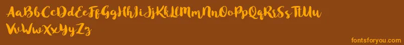 Blusty Script Free-Schriftart – Orangefarbene Schriften auf braunem Hintergrund